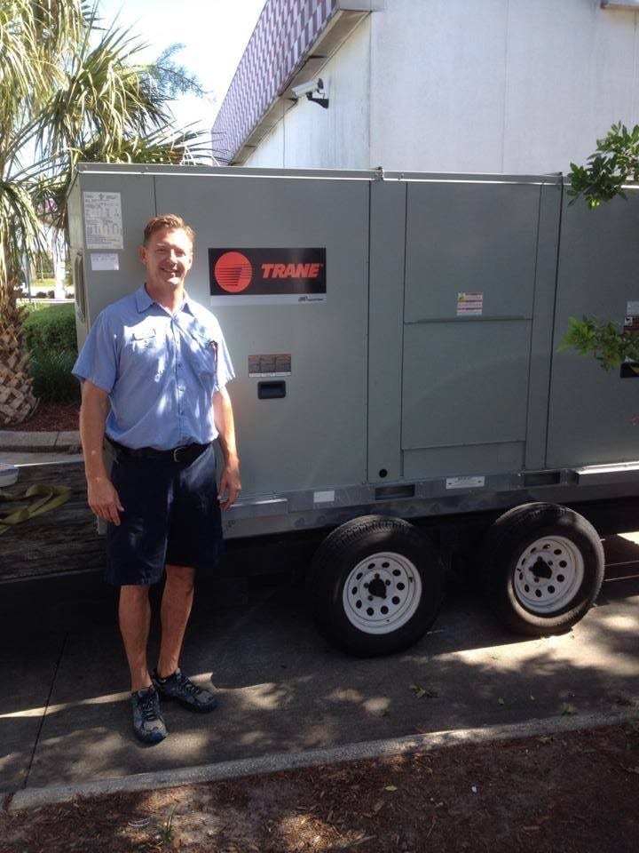 Airrific owner Todd Case inspected the new high-efficiency Trane commercial unit before installation.
