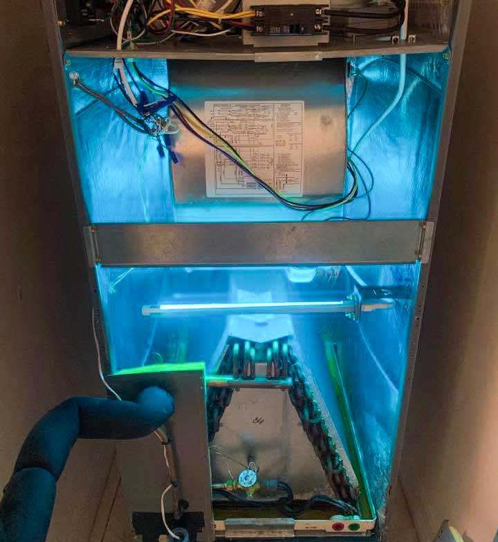 Germicidal UV light installed inside an indoor air handler system