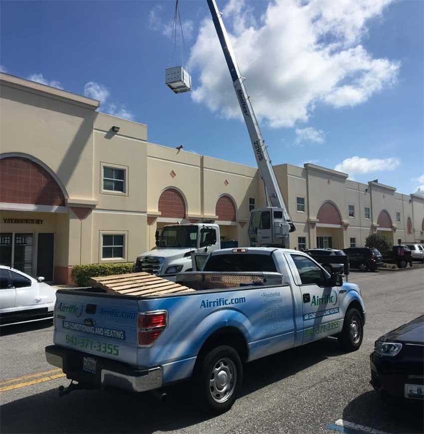 Airrific, commercial AC installer, during roof top unit installation